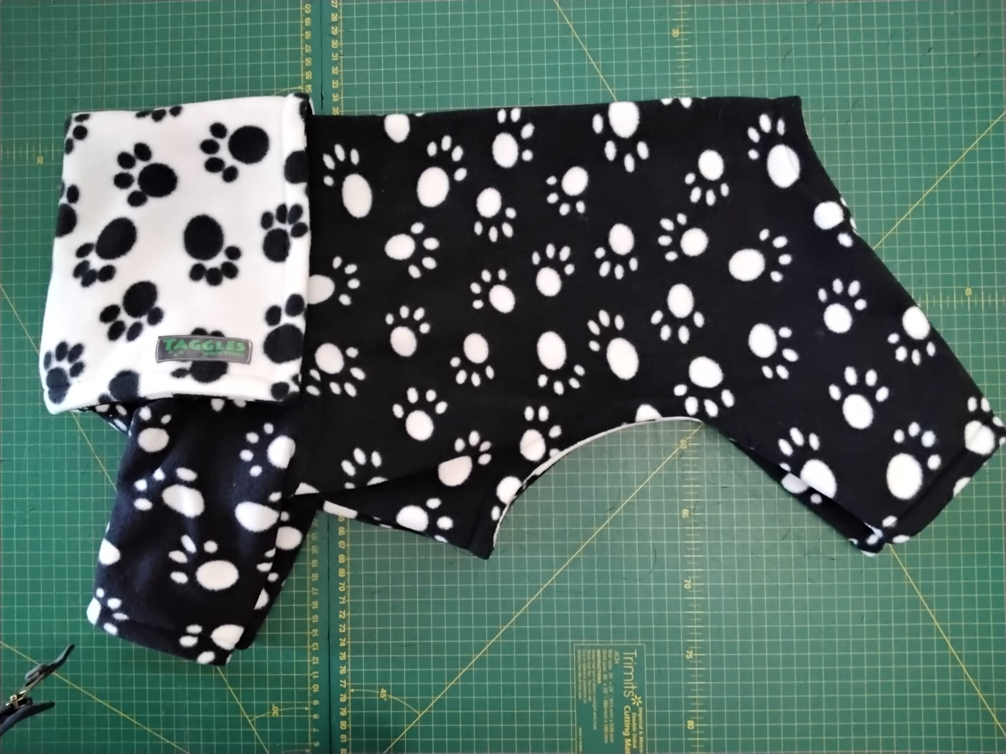 Black and white paws fleece onesie