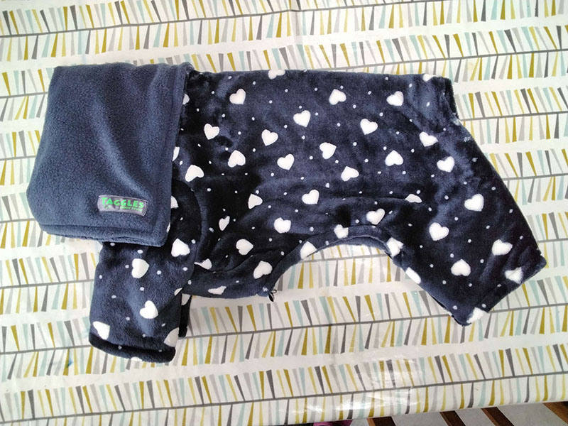 White hearts and navy fleece onesie